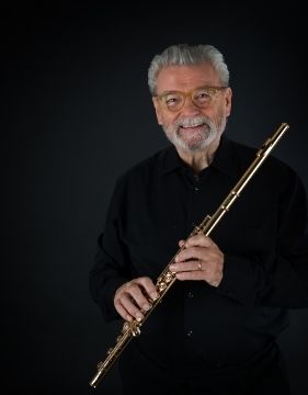 A picture of famous fulte player James Galway holding his flute