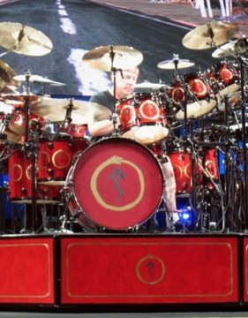 A picture of famous drummer Neil Peart while playing the drums