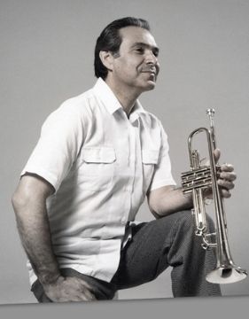 A photo of Timofei Dokschitzer holding a trumpet