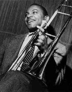 A black and white photo of trombone player Jj Johnson