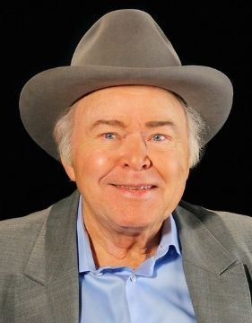 A headshot of famous banjoist Roy Clark