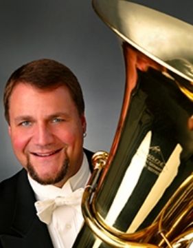 A close-up photo of tuba player Alan Baer