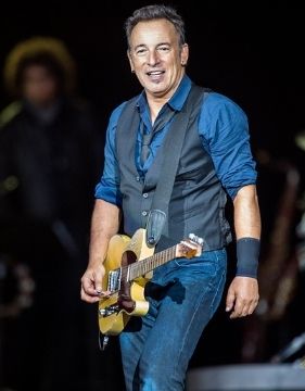 Guitarist and singer Bruce Springsteen on stage.