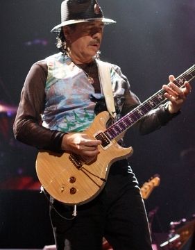 One of the best guitarists of all time, Carlos Santana performing on stage.