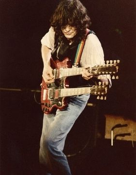 guitarist Jimmy Page performing on stage.