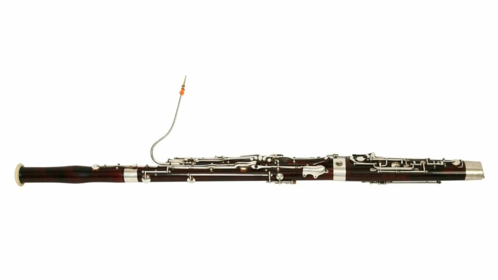A picture of woodwind instrument bassoon on a white background.