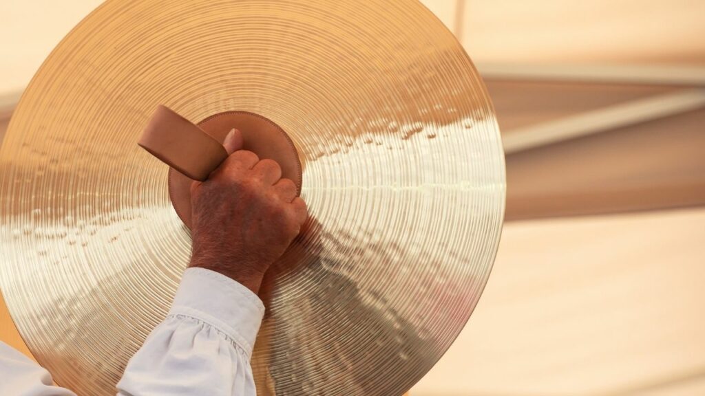 A person playing the cymbals