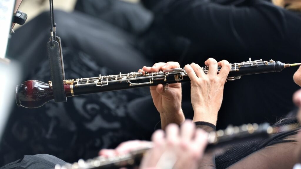 A musician playing an English horn