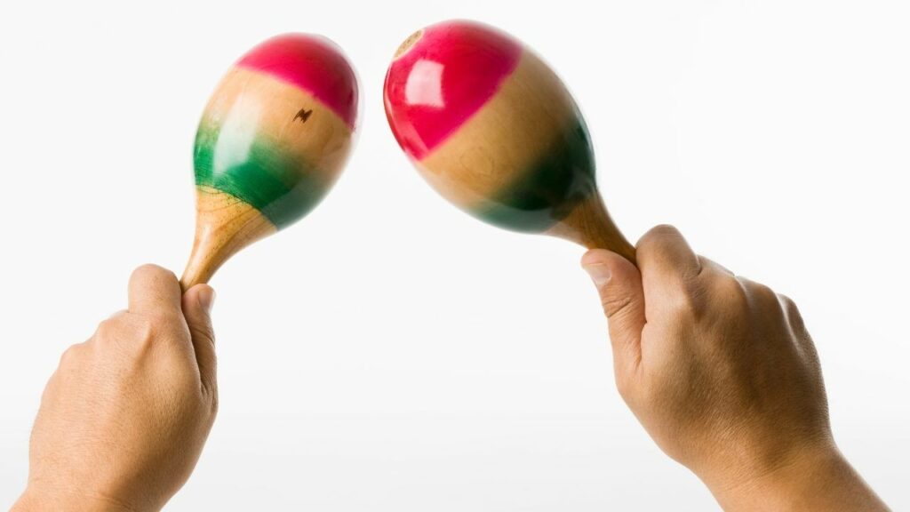 A person holding maracas