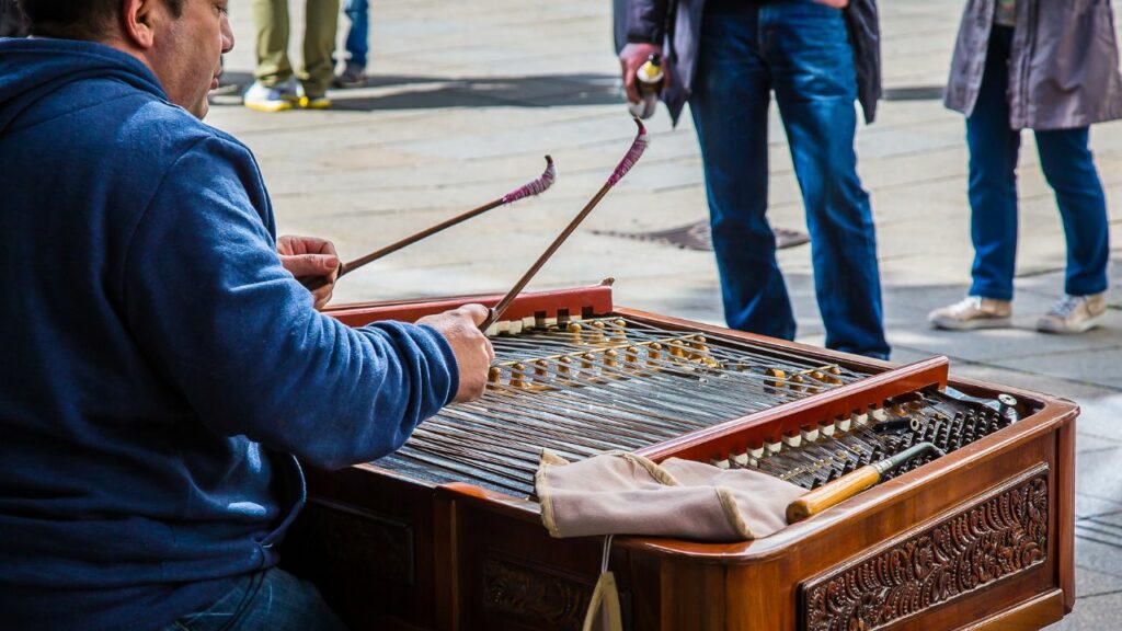 A musician playing a dulcimer.