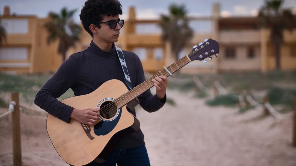 A musician playing a guitar.