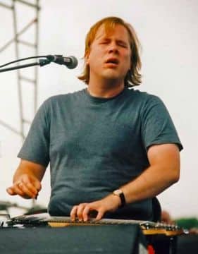 singer Jeff Healey playing the guitar