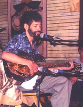 Paul Pena playing the guitar