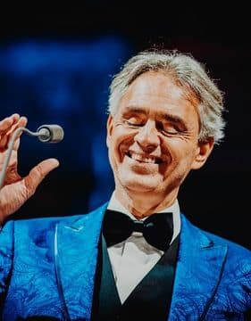 photo of famous blind opera singer, Andrea Bocelli performing on stage