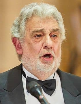 photo of opera singer Plácido Domingo performing on stage.