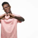 Black man making heart Shutterstock