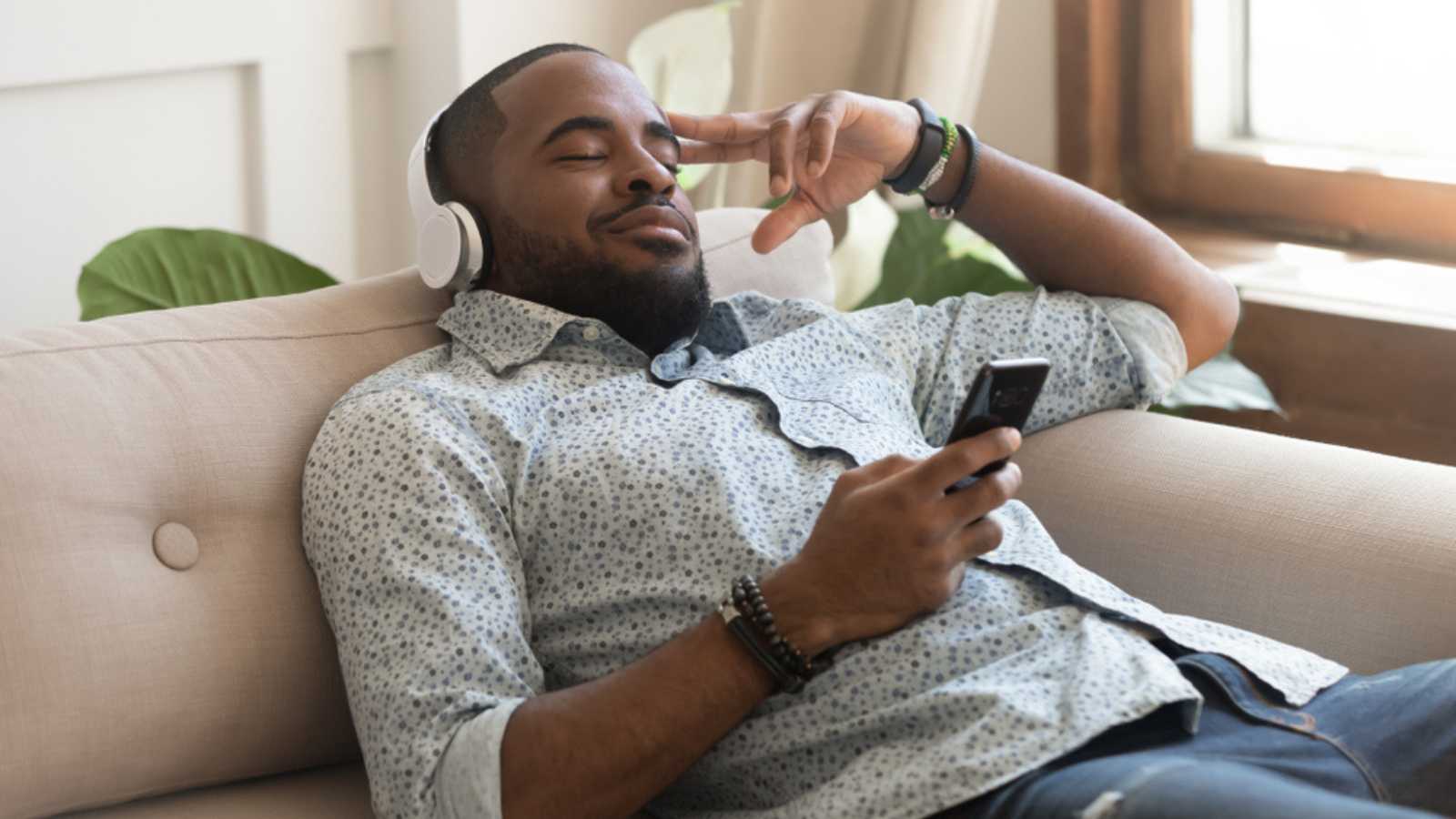 Man Enjoying Music With Closed Eyes