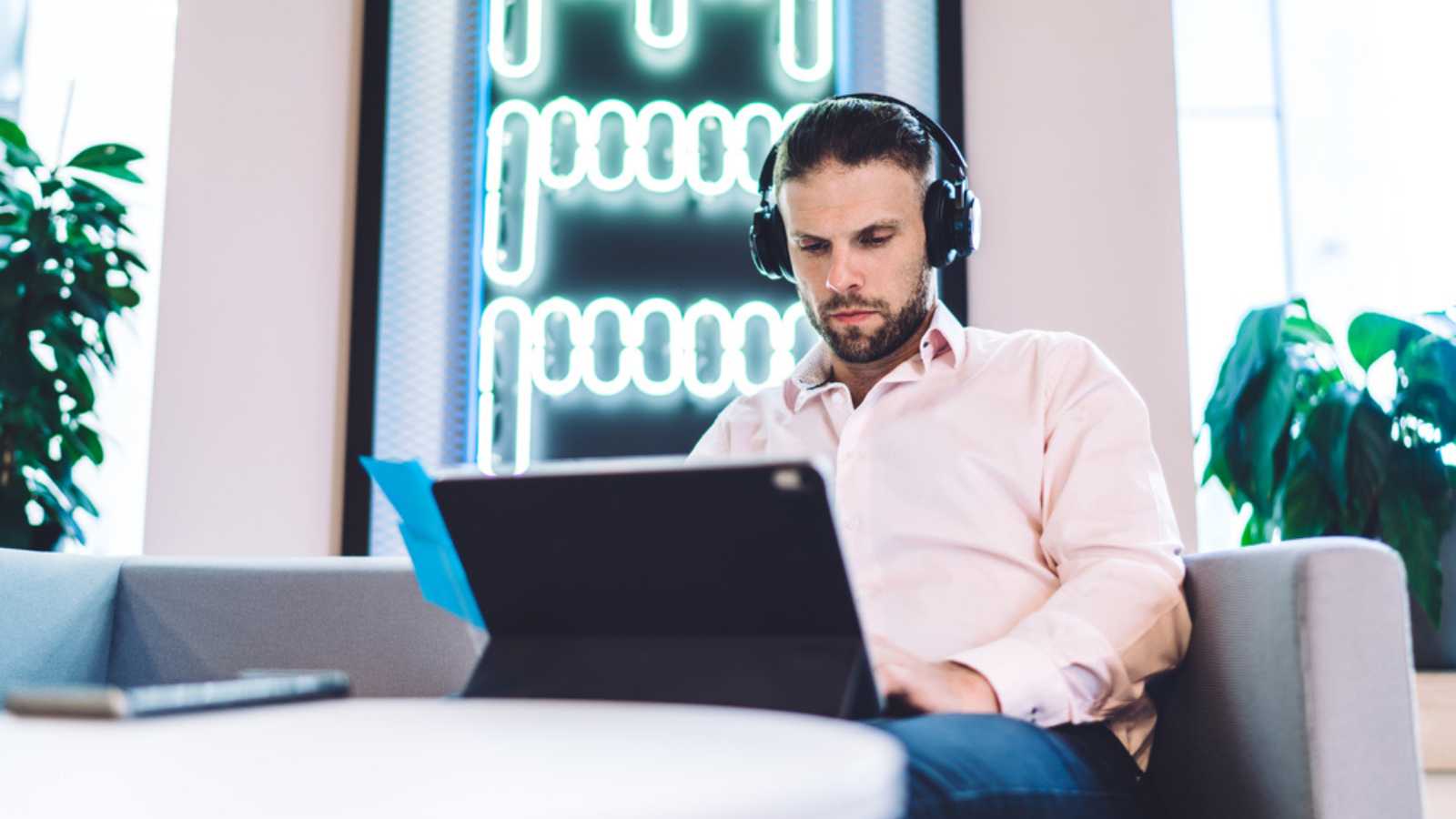 Man Listening To Music While Working
