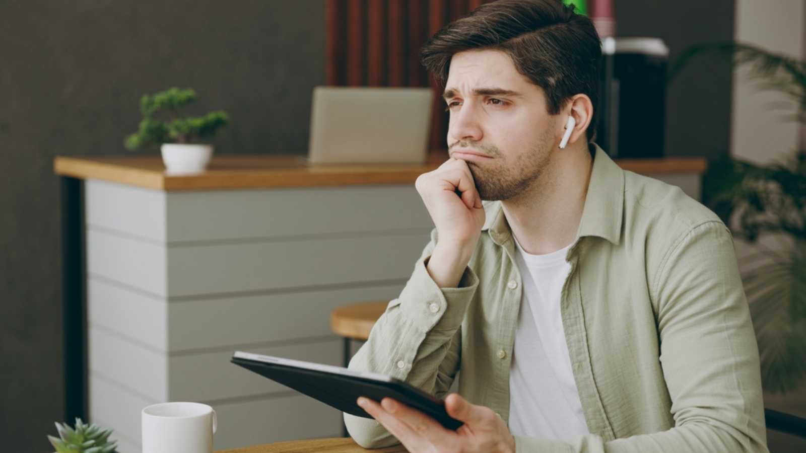 Sad Man With Ear Pods