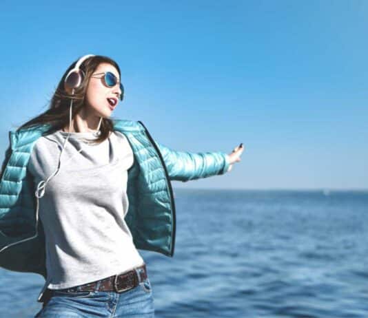 Woman Listening To Music Sea Side