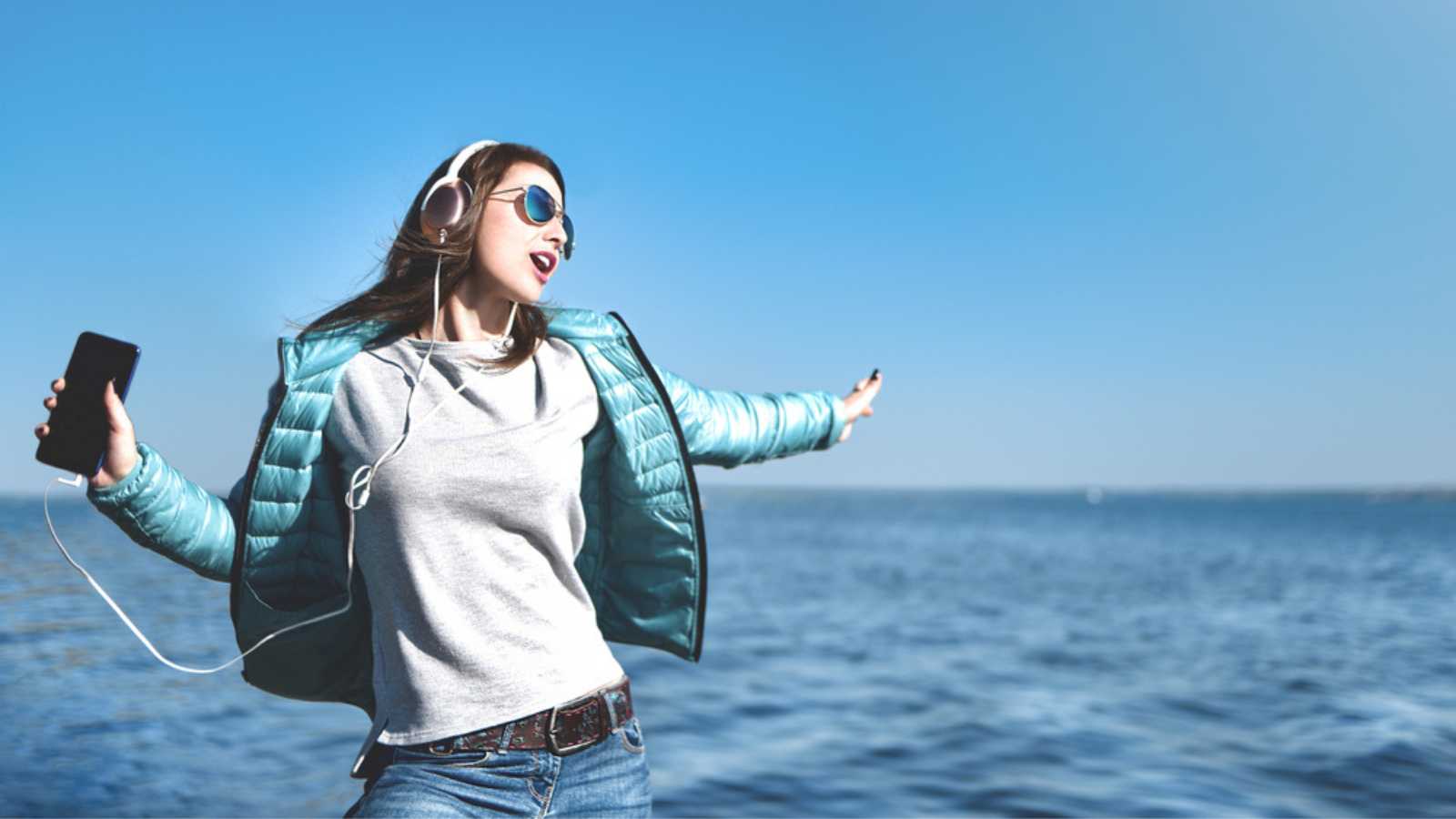 Woman Listening To Music Sea Side