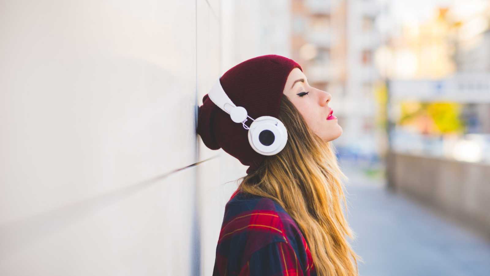 Woman Listening To Music With Closed Eyes