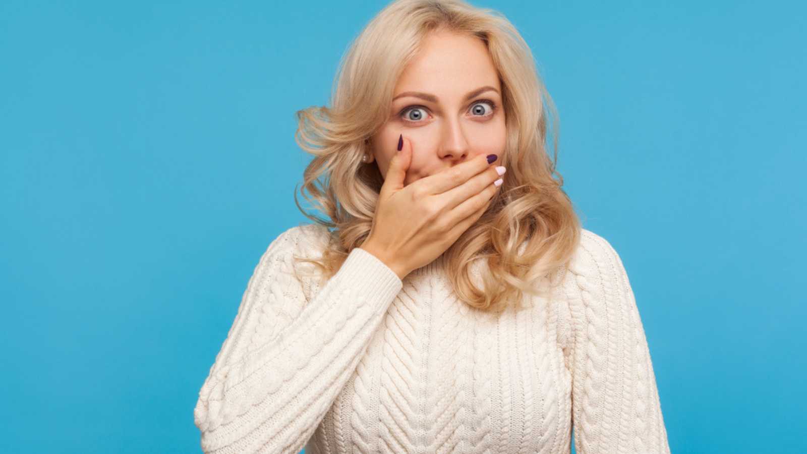 Woman Shocked Closing Mouth