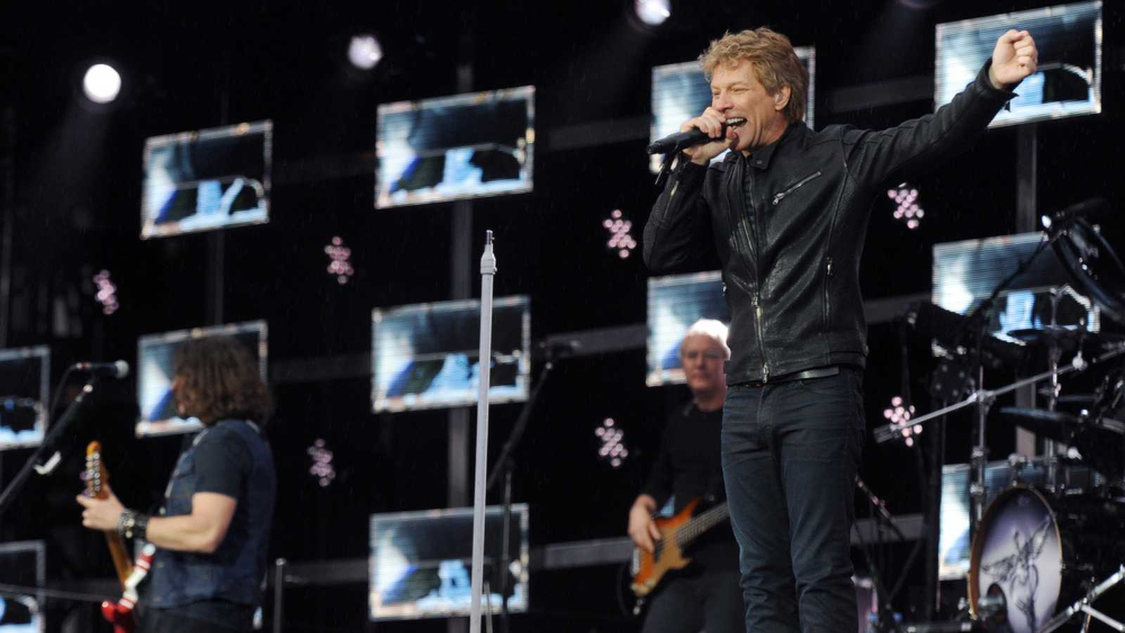 PRAGUE - JUNE 24: Famous American singer Jon Bon Jovi (right) of Bon Jovi rock band during performance in Prague, Czech republic, June 24, 2013
