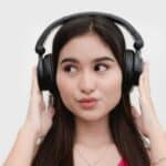 Woman hearing Pop song with headphone