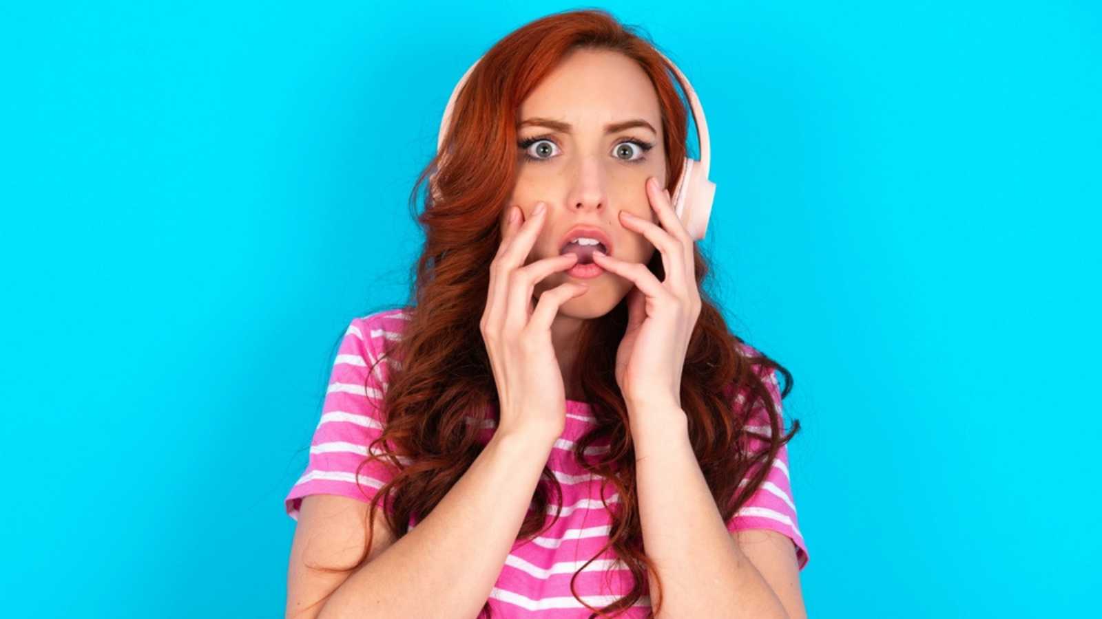 Woman Listening To Music Frightened