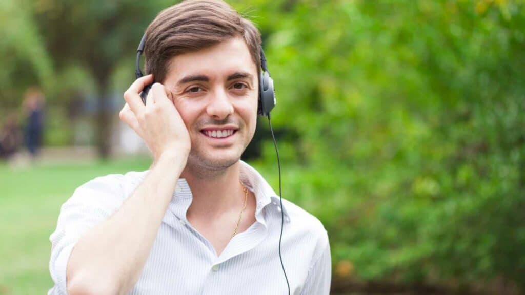 Young Handsome man Hearing Pop Song