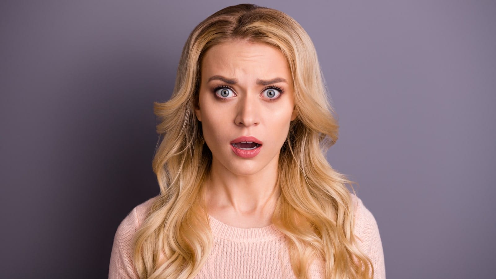 Shocked Woman Stunned Wow Shutterstock