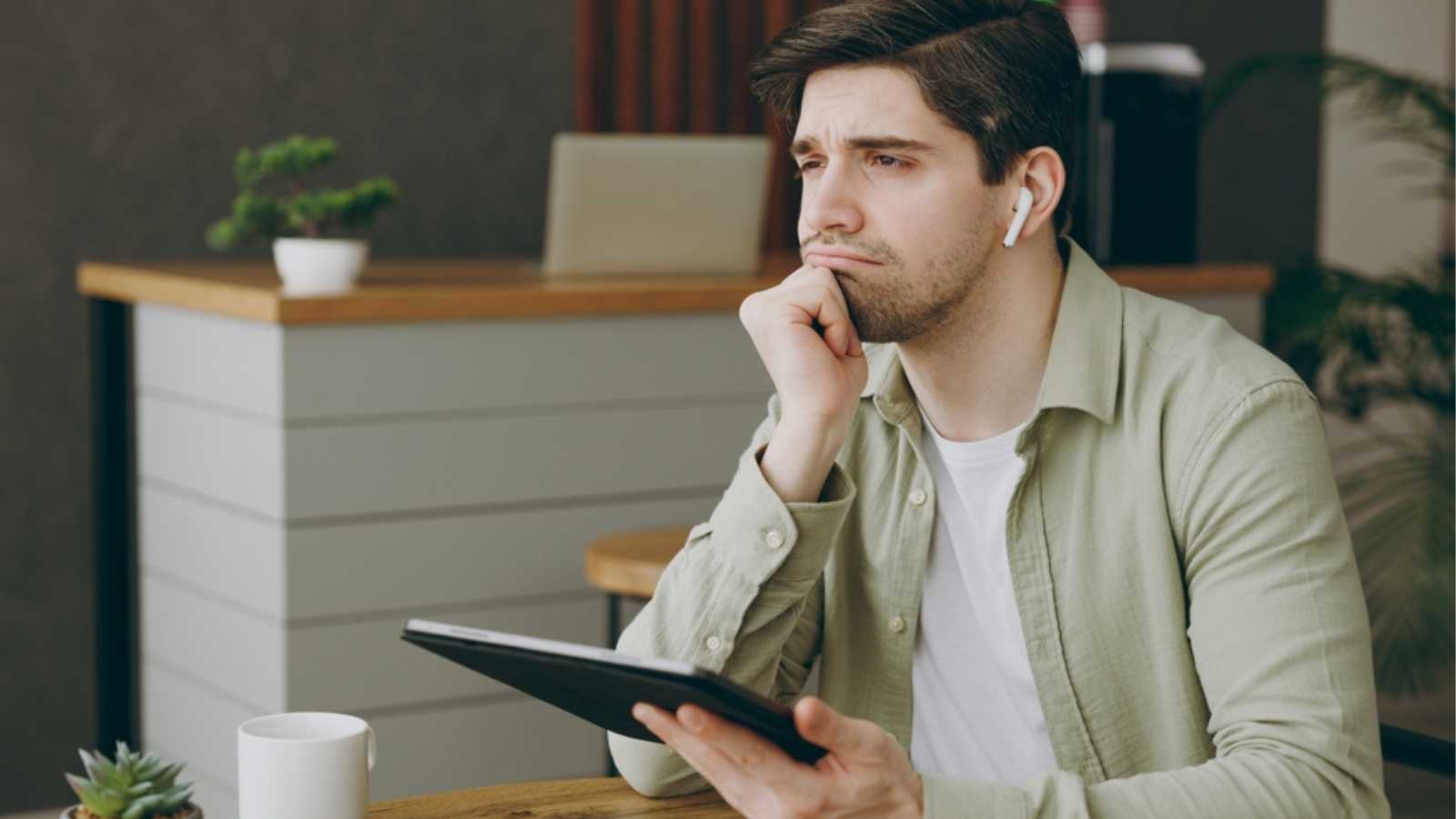 Sad Man Listening To Song In Airpod