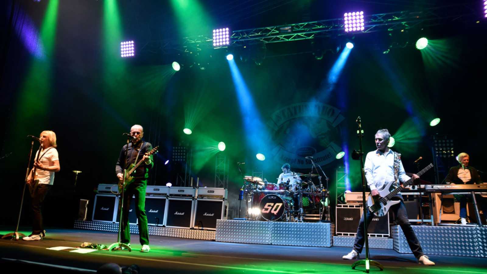 WROCLAW, POLAND - MAY 1, 2016: Status Quo band during concert Guitar Guinness World Record.