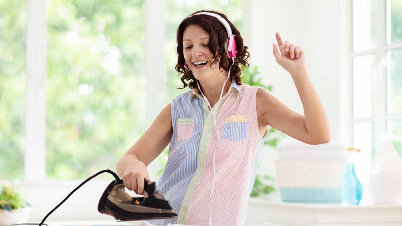 Woman Dancing While Ironing