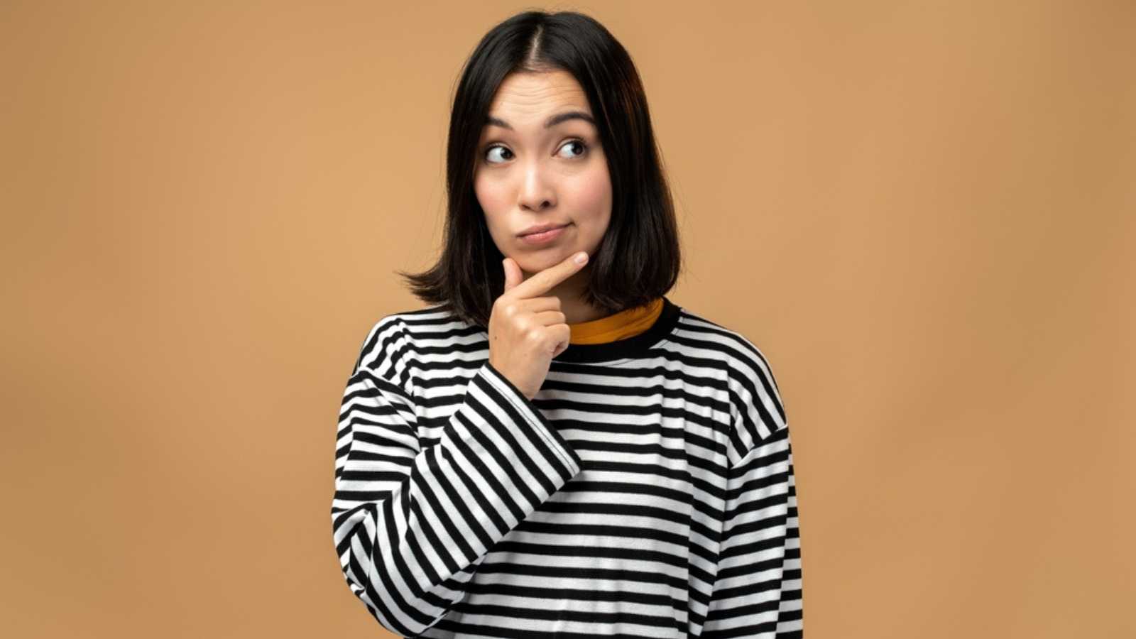 Woman Thinking with hands on chin