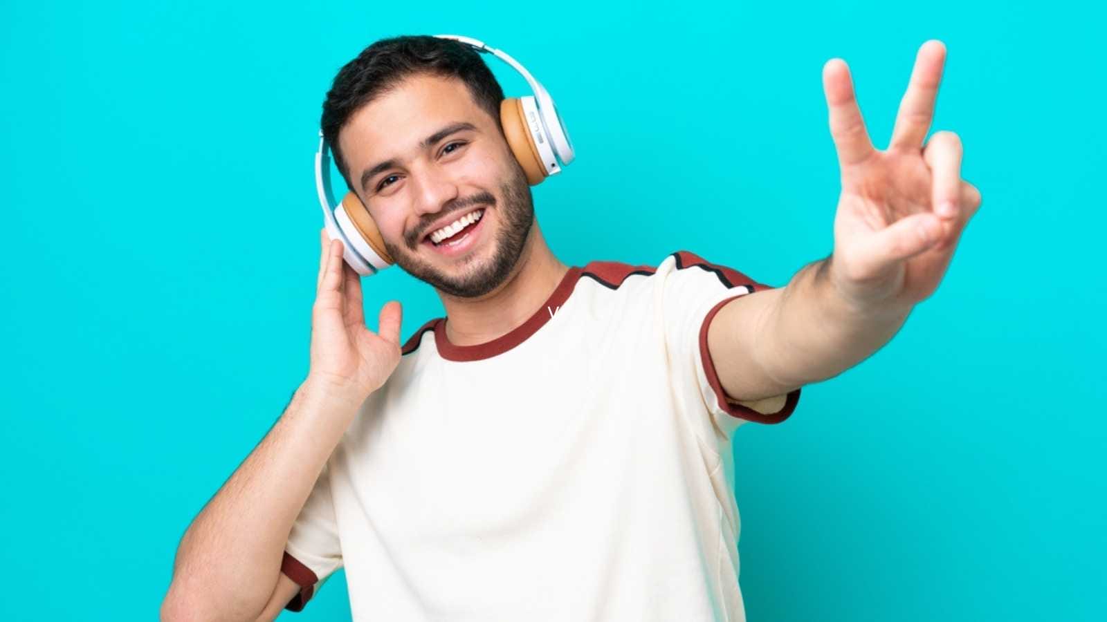 Young man hearing music