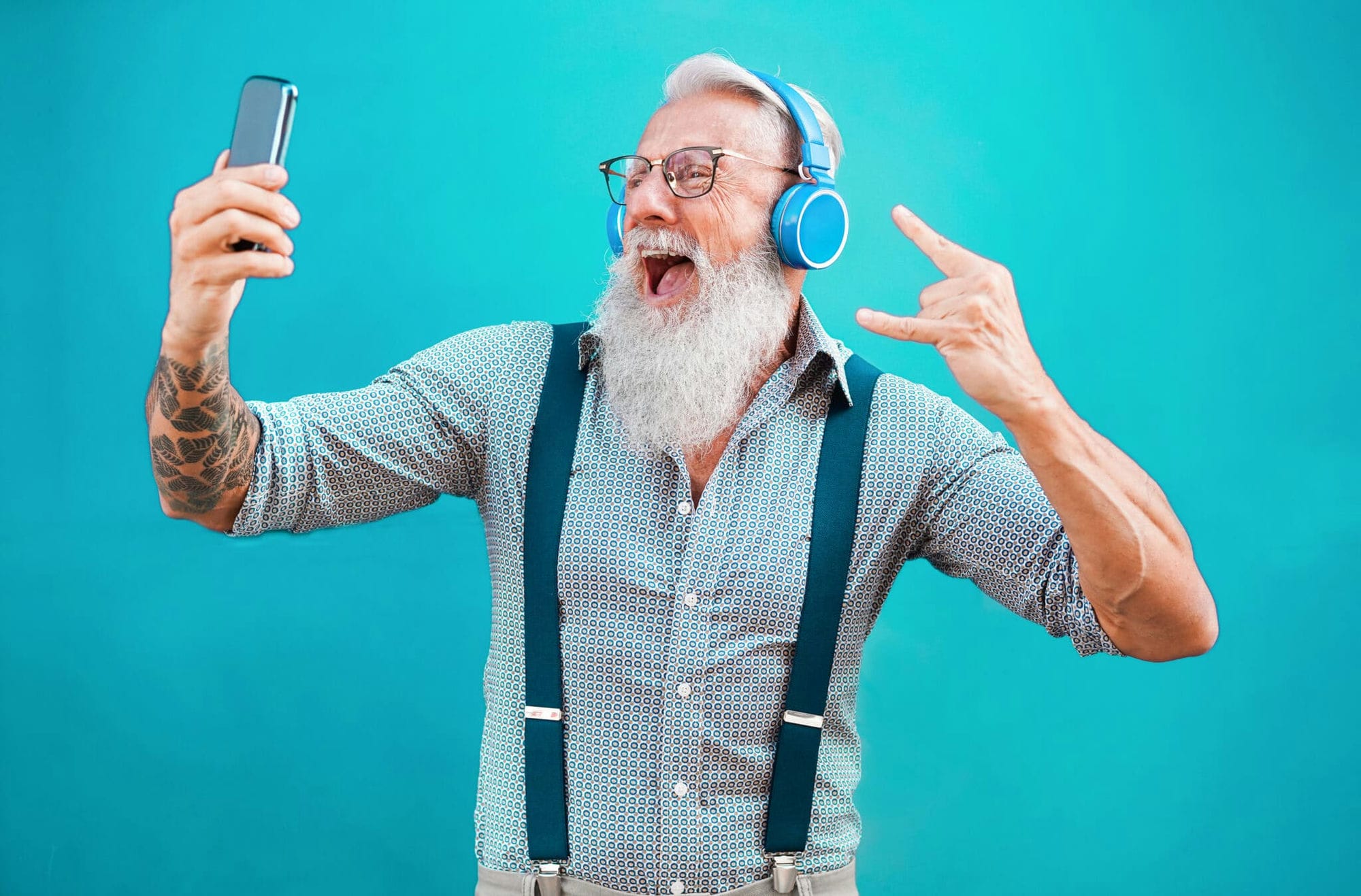 Senior Crazy Man Using Smartphone App For Creating Playlist With