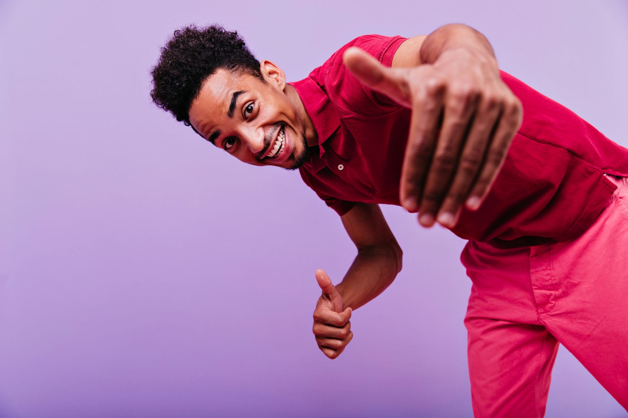 Excited Black Male Model Dancing In Studio. Funny Emotional Man