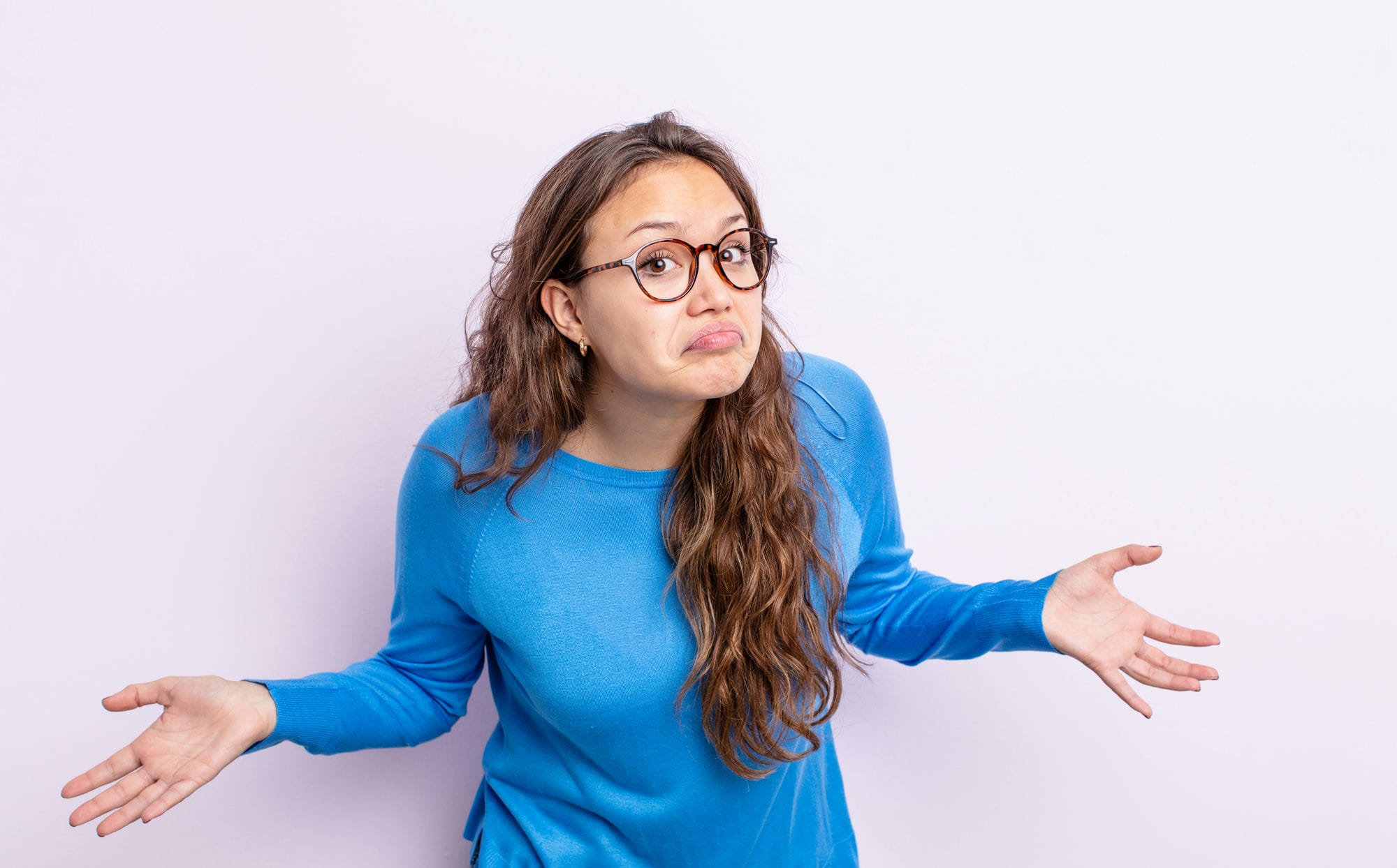 Image Of A Confused Young Beautiful Woman Posing Isolated Over