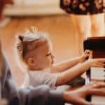 Little kid playing piano