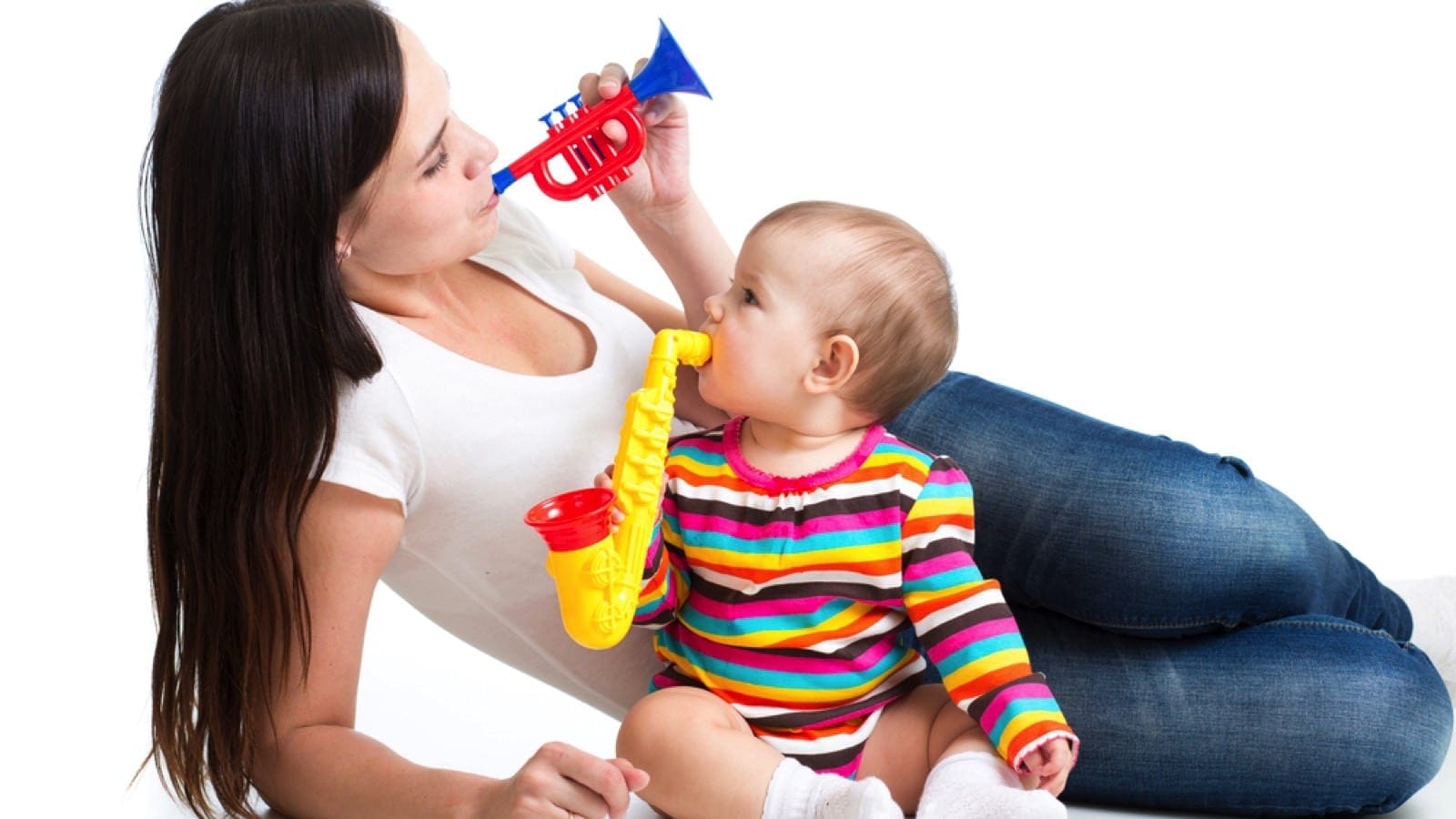Mother And Baby Girl Having Fun With Musical Toys
