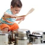 Toddler trying to play drums