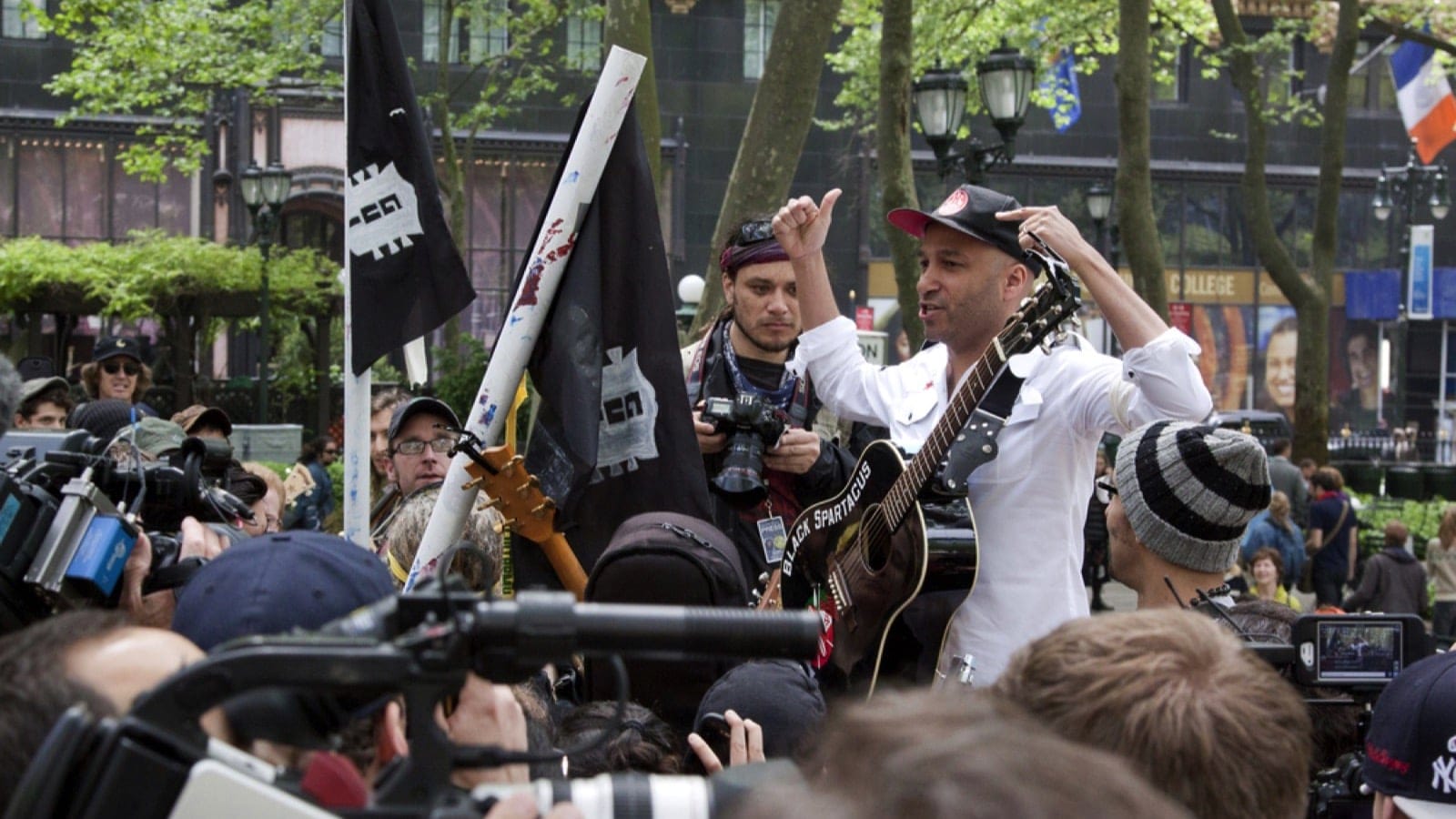 NEW YORK - MAY 1: Rage Against The Machine guitarist Tom Morello speaks to the Occupy Guitarmy group during May Day protests in Bryant Park on May 1, 2012 in New York, NY.
