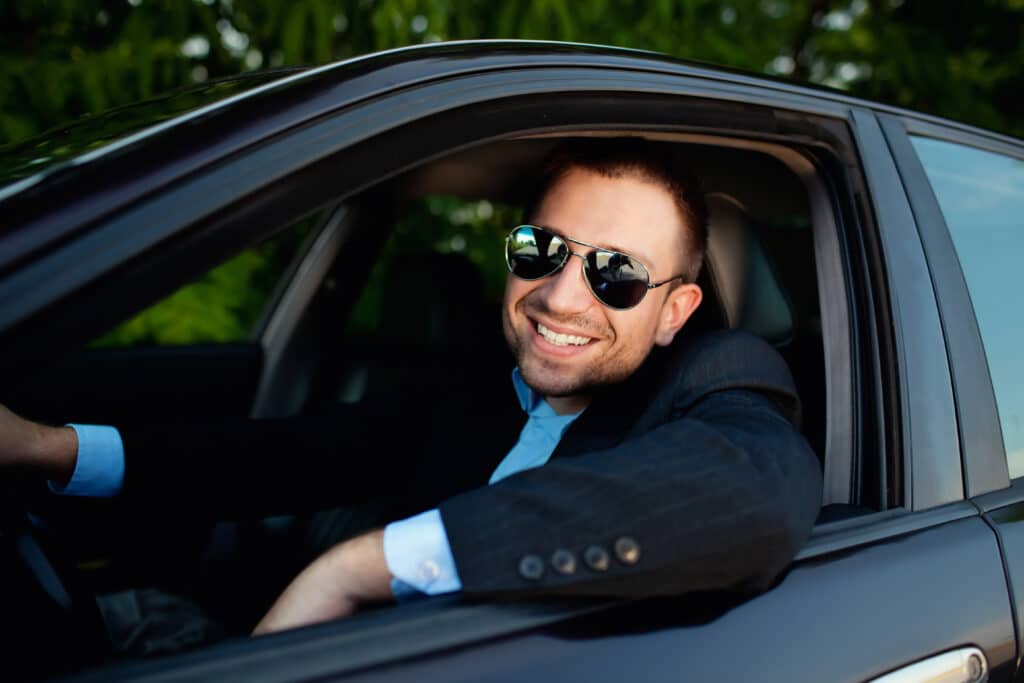 Businessman In Car Smiling