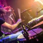 Drummer (blurred motion) playing on drum set